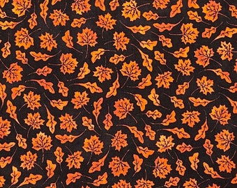 Halloween fabric -- Small, orange fall leaves scattered on black -- 100% cotton quilting fabric