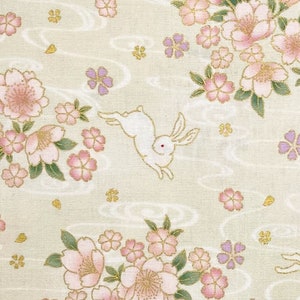 Japanese fabric -- Bunnies hopping through cherry blossoms with metallic gold highlights on cream -- 100% cotton quilting fabric