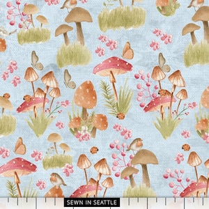 Mushroom fabric -- Watercolor mushrooms, lady bugs, birds, and butterflies repeated on light blue -- 100% cotton quilting fabric