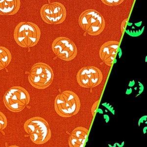 Halloween fabric -- Glow-in-the-dark Jack-O-Lanterns on orange -- 100% cotton quilting fabric