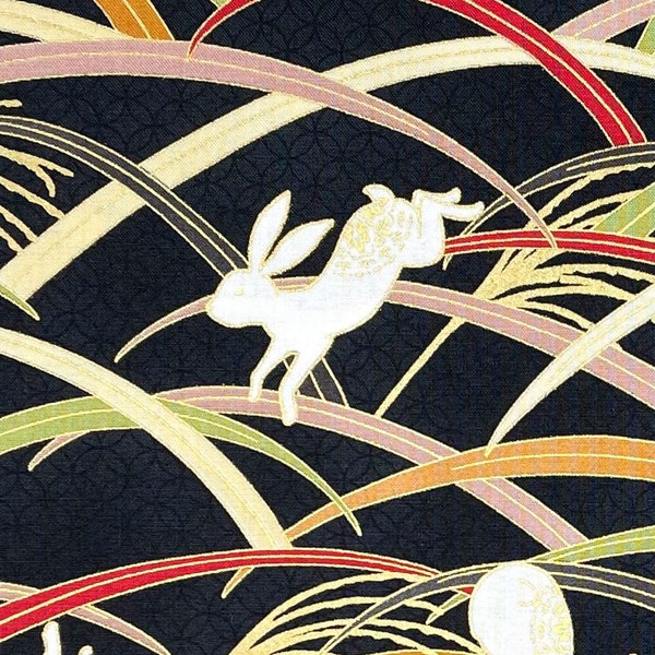 Japanese fabric -- Bunnies hopping through multicolor grass with metallic gold highlights on black -- 100% cotton quilting fabric