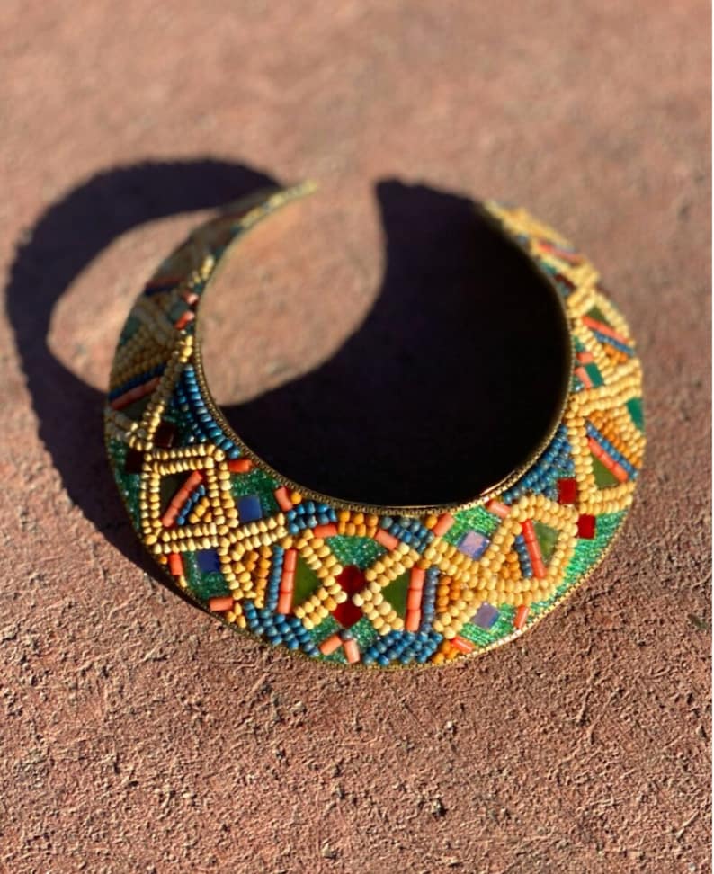 Big beaded copper neck plate with large synthetic beads and metallic threading by M /& J Hansen.