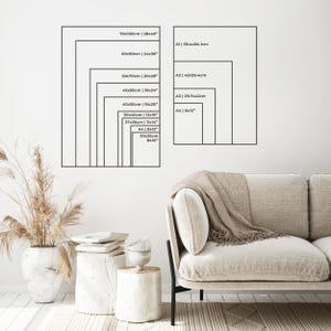 a living room with a couch and a plant