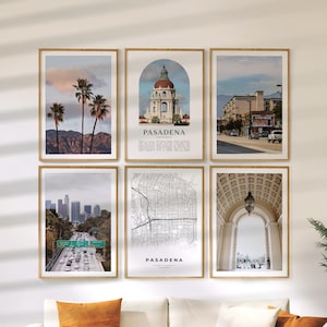 May include: A set of six framed art prints depicting Pasadena, California. The prints display various scenes, including palm trees, a city map, and architectural features. Each print is presented in a wooden frame, forming a coordinated wall art collection.
