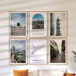 May include: Six framed art prints showcasing Panama City. The prints include cityscapes, a map, and architectural details. The prints are displayed on a white wall above an orange sofa.