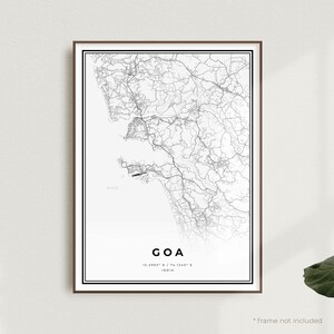 May include: A framed black and white map print of Goa, India. The map features intricate road and geographical details. The word "GOA" is centered at the bottom, with coordinates and "INDIA" below. The frame is brown.