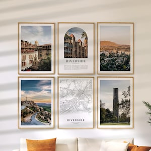 May include: Six framed art prints with wooden frames. The prints feature scenic views and a map of Riverside, California. One print has the word "RIVERSIDE" in bold white letters. The prints are displayed on a white wall above an orange couch.