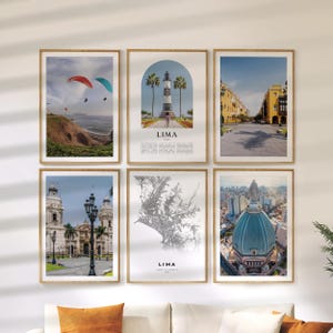 May include: Six framed art prints featuring scenes of Lima, Peru. The prints include images of paragliders, a lighthouse, city streets, a cathedral, a map, and a building with a blue dome. The prints are in wooden frames.