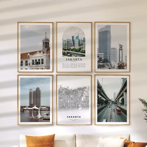 May include: A set of six framed prints depicting Jakarta, Indonesia. The images include cityscapes, architectural details, and a map. The prints are in neutral tones and are displayed in wooden frames, forming a coordinated wall art arrangement.