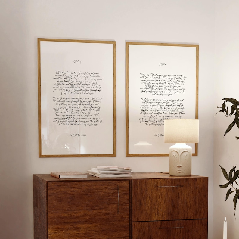 Wedding vow prints set on a dresser, elegantly framed in matching wood frames, perfect for anniversary gifts or wedding decor.
