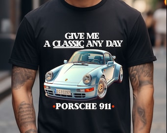 May include: A black t-shirt with white text that reads "Give me a classic any day." and a blue Porsche 911 car illustration. The number plate reads "D-C93297" and the text "Porsche 911" is below the car.