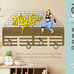 May include: A wooden medal holder with a brick wall design and a yellow "Hip Hop" graphic. A cartoon dancer is featured on the wall. The holder has four slots for medals.