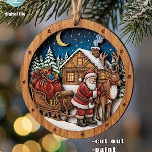 May include: A circular wooden Christmas ornament featuring a multi-layered laser-cut design of Santa Claus with a reindeer, a sleigh filled with gifts, and a cabin in a snowy landscape under a crescent moon, suspended by a jute twine loop.