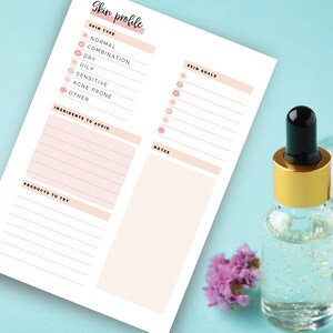 May include: A skincare profile sheet with headings for skin type, skin goals, ingredients to avoid, products to try, and notes. A clear glass bottle with a gold cap and a black dropper is next to the sheet. A small purple flower is also next to the bottle.