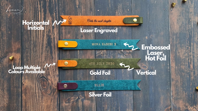 May include: Four leather bookmarks with different personalization options. The top bookmark is laser engraved with the initials "SB" and the text "Onto the next chapter". The second bookmark is embossed with the text "MONA HABIBI X". The third bookmark is embossed with the text "4TH JULY 2020" in gold foil. The bottom bookmark is embossed with the name "ELLIE" in silver foil.