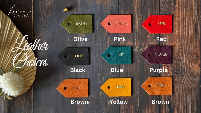 May include: Leather swatches in eight different colors: olive, pink, red, black, blue, purple, brown, and yellow. Each swatch has a number from one to eight written on it.