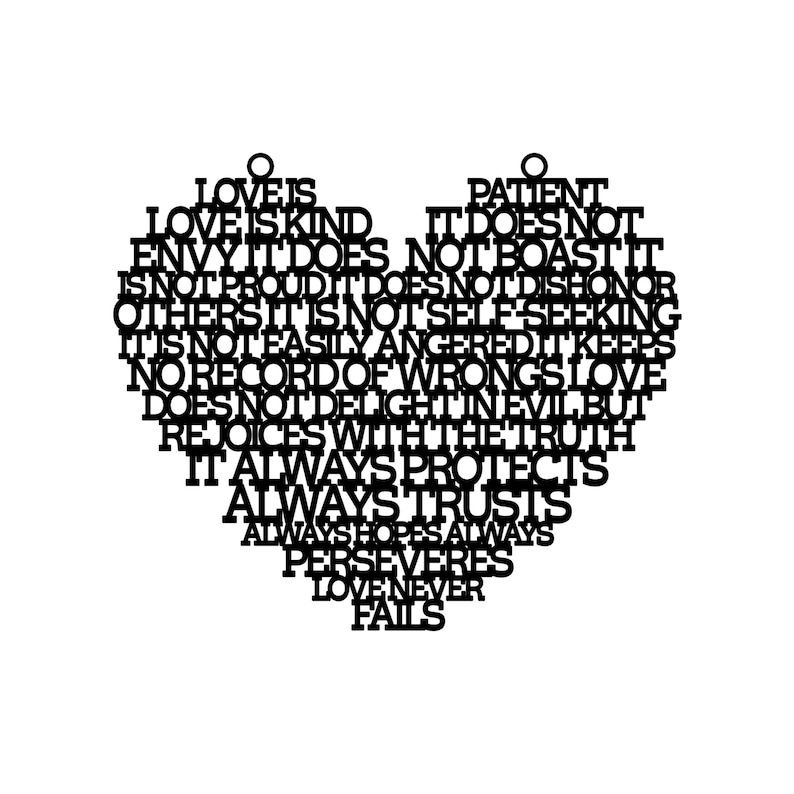 May include: A black heart-shaped wall hanging with the words "Love is Kind" and other phrases about love cut out of the material. The words are arranged to form the shape of a heart.