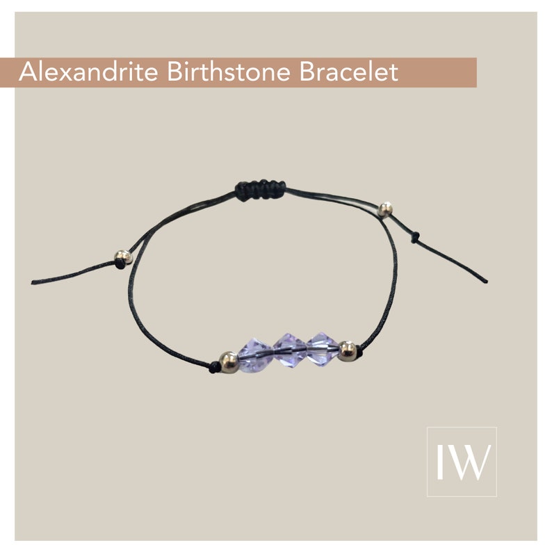 May include: A black adjustable string bracelet with a silver clasp and three light purple crystal beads. The bracelet is labeled "Alexandrite Birthstone Bracelet".