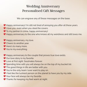 May include: A list of personalized wedding anniversary gift messages. The text includes phrases like "Happy anniversary!" and "I love you." The messages are displayed in a clean, easy-to-read format, with a heart symbol next to each message.