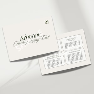 May include: A white pamphlet with the Arbonne Healthy Living Club logo and text about Essential Meal Replacement Products, CleanTox Herbal Detox Tea, and Love Synergy Elixir.
