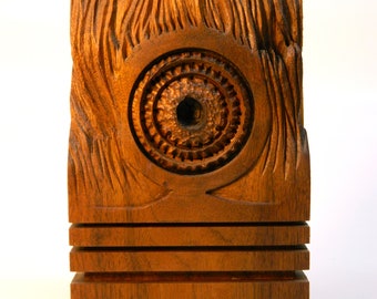 Eye of Fire is a one of a kind, hand carved, soled Black Walnut sclupture