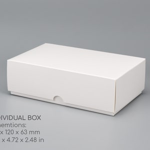 May include: A white cardboard box with a lid. The box measures 7.75 inches by 4.72 inches by 2.48 inches.