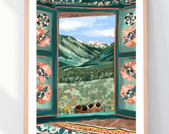 May include: A framed art print depicting an open window with teal shutters decorated with pink floral patterns. The view through the window shows a green mountain landscape under a blue sky, with a pair of brown shoes resting on the sill.