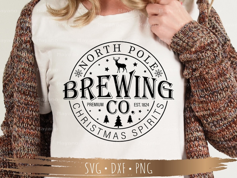 May include: White t-shirt featuring a black circular design with the text "NORTH POLE BREWING CO. CHRISTMAS SPIRITS". The design includes a deer, snowflakes, and pine trees. The shirt also has the text "EST. 1824".