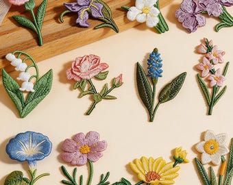 Apliques termocolantes com flores de nascimento, margaridas, lírios e rosas, bordados de plantas.