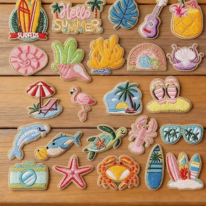 May include: A collection of embroidered iron-on patches featuring summer and beach themes, including surfboards, a flamingo, a turtle, a crab, a lobster, a camera, sunglasses, and tropical plants, with the text Longancraft and Hello Summer.