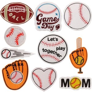 May include: Set of 10 embroidered iron-on patches featuring baseball and softball themes. The patches include a baseball, a softball, a glove, a bat, a heart, and text that says "Game Day", "Let's Play Together", and "Mom".