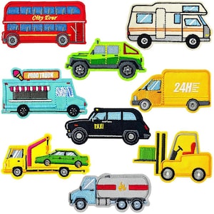 May include: A collection of embroidered patches featuring various vehicles, including a red double-decker bus, a green jeep, a yellow delivery truck, a black taxi, and a blue food truck. The patches are in various colors and styles.