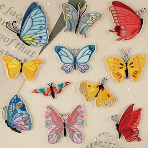 May include: Assortment of ten embroidered iron-on butterfly patches in various colours, including blue, yellow, pink, red, and green. The patches are perfect for adding a touch of whimsy to clothing, bags, or other fabric items.