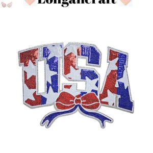 May include: A patriotic USA patch with red, white, and blue sequin detailing. The letters are outlined in silver and feature a bow with a blue ribbon. The text "Longancraft" is at the top.