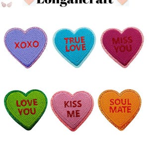 May include: Six embroidered heart-shaped patches in various colors, each with a different message. The messages include "XOXO", "TRUE LOVE", "MISS YOU", "LOVE YOU", "KISS ME", and "SOUL MATE". The brand name "Longancraft" is at the top.