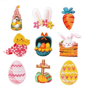 May include: Set of 10 embroidered iron-on patches featuring Easter themes. The patches include a gnome, bunny ears, carrot, chick in an egg, basket of eggs, bunny in a box, egg, cross with eggs, and two eggs with hearts.