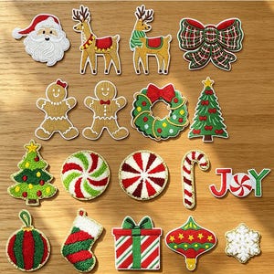 May include: A collection of embroidered Christmas-themed patches including Santa Claus, reindeer, a plaid bow, gingerbread people, a wreath, Christmas trees, peppermint candies, a candy cane, the word JOY, ornaments, a stocking, a gift, and a snowflake.