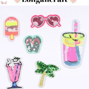 May include: Six colorful iron-on patches with a summer theme. The patches feature a popsicle, sunglasses, flip flops, a milkshake, a palm tree, and a glass of iced tea.