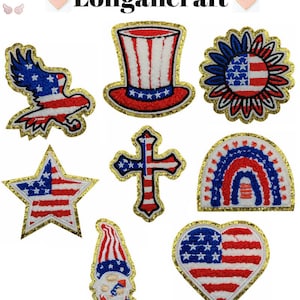 May include: Nine iron-on patches with an American flag theme. The patches include a star, a heart, a cross, a gnome, a hat, a sunflower, a rainbow, and an eagle. All patches have a gold glitter outline.