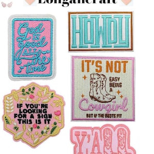 May include: Five embroidered iron-on patches with pink, white, and blue colors. The patches feature the phrases "God is good all the time", "Howdy", "It's not easy being a cowgirl but if the boots fit", "If you're looking for a sign this is it", and "Y'all".
