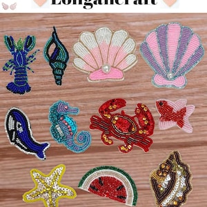 May include: A selection of beaded patches with marine themes, such as a blue lobster, a seahorse, a crab, and a starfish. Other designs include a seashell, a fish, a whale, a watermelon slice, and a leaf. The word "Longancraft" is at the top.