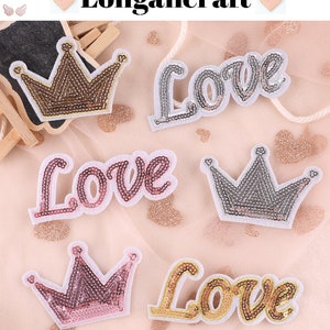 May include: Five iron-on patches featuring the word "Love" in different colors and styles, and two gold crowns with sequins.