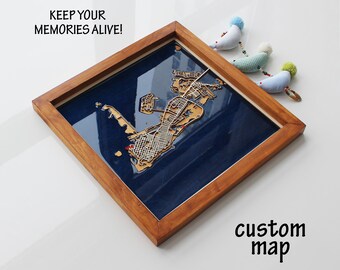 May include: A custom map of a city or town, framed in a dark wood frame. The map is made of wood and is raised from the background. The map is on a blue background. The text "KEEP YOUR MEMORIES ALIVE!" is at the top of the image. The text "custom map" is at the bottom of the image.