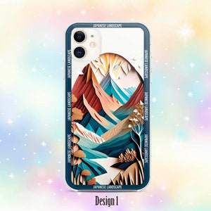 Op de afbeelding: Een telefoonhoesje met een witte achtergrond en een kleurrijk papier-uitgesneden ontwerp van een Japans berglandschap. Het ontwerp bevat tinten blauw, groen, bruin en oranje. De tekst "JAPANESE LANDSCAPE" wordt herhaald rond de rand van het hoesje.