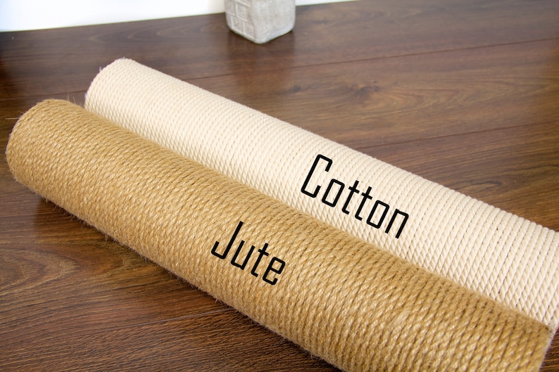 May include: Two rolls of rope for cat scratching posts, one is natural jute and the other is white cotton. The jute roll is labelled "Jute" and the cotton roll is labelled "Cotton".