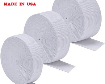 May include: Three rolls of white elastic band, each rolled up and ready to use. The elastic is a woven material with a slightly textured surface. The text "FRK MADE IN USA" is printed on a white background.