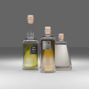 May include: Three glass bottles with cork stoppers, each containing a different liquid. The bottles are labeled with text. The liquid colors range from light green to amber and white. The bottles are on a white surface against a gray background.
