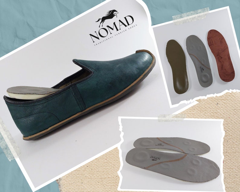 May include: A pair of green leather slip-on shoes with a brown sole. The shoes are shown with a pair of gray insoles. The insoles have the text "Nomad" printed on them. The shoes are made by Nomad, a company that makes traditional Turkish shoes.