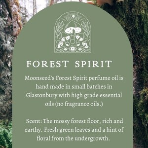 May include: An image featuring the text "FOREST SPIRIT" with a mushroom illustration. The text describes a perfume oil with essential oils of cedarwood, juniperberry, lavender, and oakmoss. The scent is described as mossy forest floor, rich and earthy.