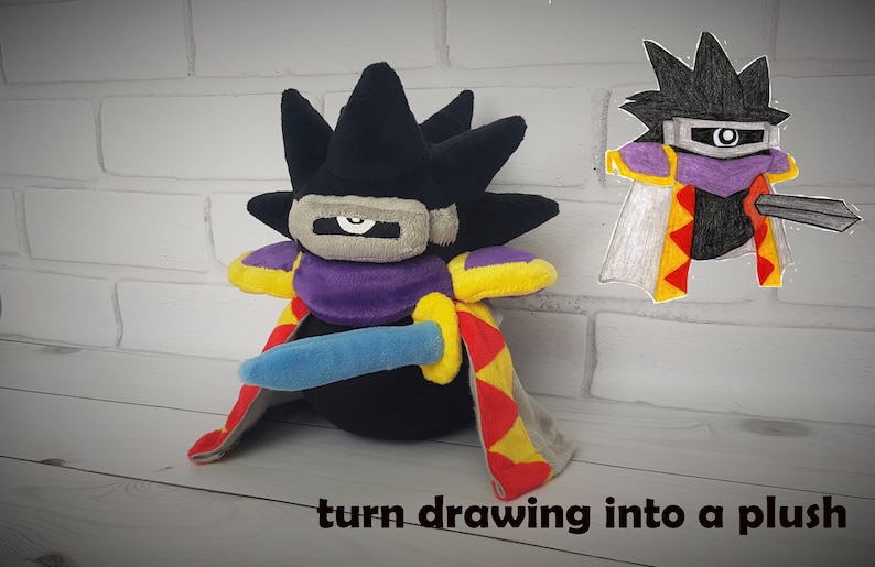 May include: A black and gray plush toy with a purple and yellow cape and a blue sword. The toy is based on a drawing of a character with a single eye and a spiky head.